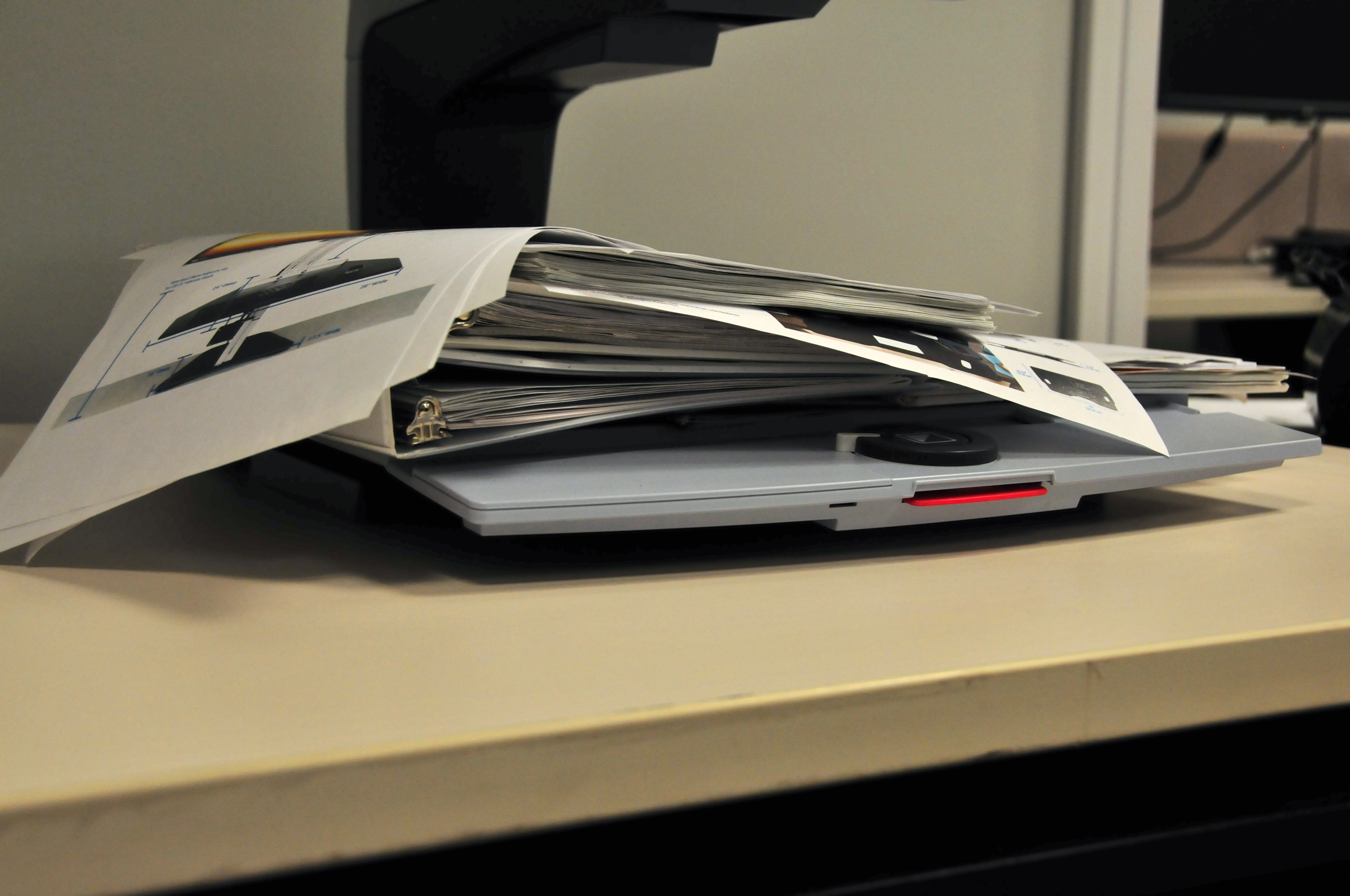 An untidy pile of files and documents
